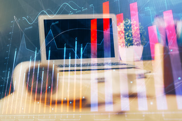 Stock market graph and table with computer background. Multi exposure. Concept of financial analysis.