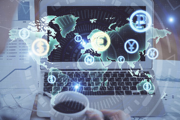 Forex market chart hologram and personal computer background. Multi exposure. Concept of investment.