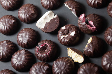 Background from marshmallows. Broken, cut, cracked, whole