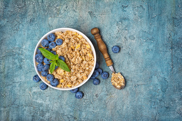 Fototapeta premium Oat flakes or granola with fresh blueberry for healthy breakfast