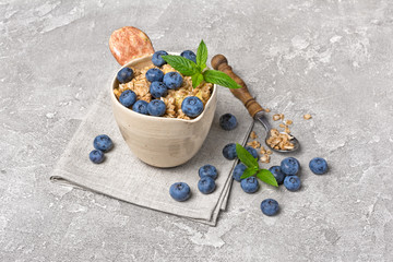 Oat flakes or granola with fresh blueberry for healthy breakfast