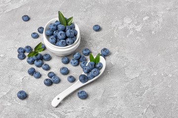 Fresh blueberry berries in white bowl
