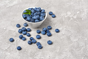 Fresh blueberry berries in white bowl