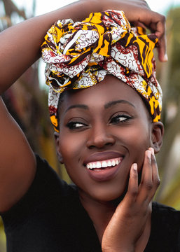 Close of smiling woman wearing head wrap