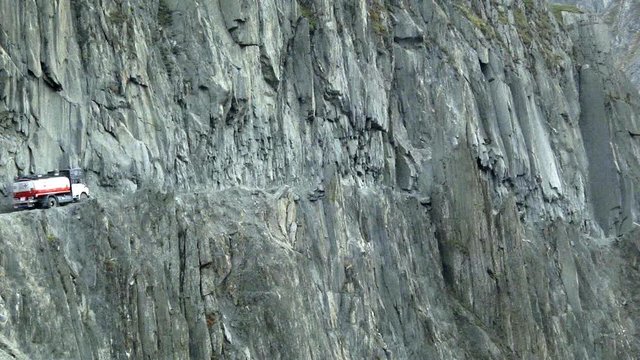 Truck paving it's way between Sarahan and Nako route at the Indian Himalayas, wide shot