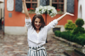 Street fashion portrait of young beautiful european women woman walking in the city.