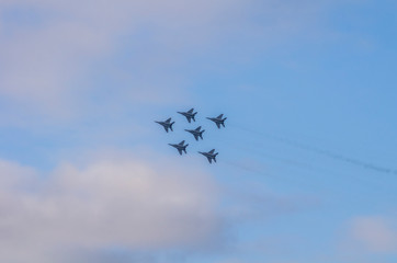 Naklejka na ściany i meble Russian airplanes aerobatic team in the sky