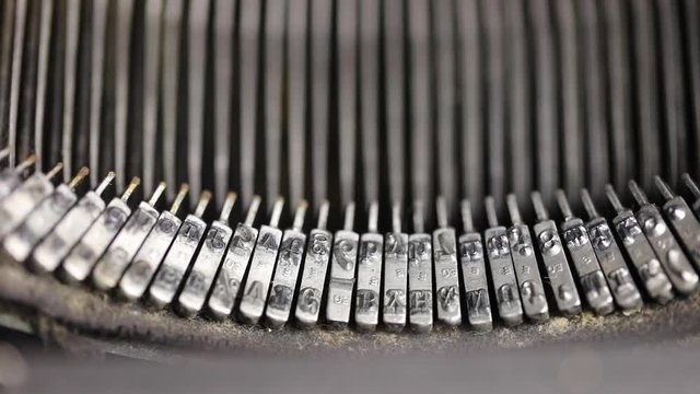 Typing keys on inside of vintage typewriter with sound.