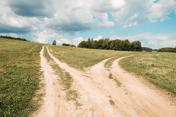 Fototapeta na wymiar two rural road between fields