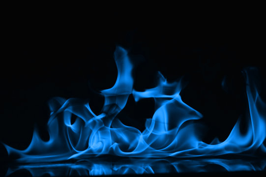 Beautiful fire blue flames on a black background. Stock Photo