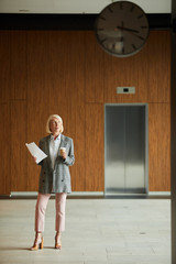 Businesswoman waiting at office hall