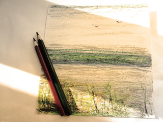 Sepia drawing with a pastel and pencil sketch with a view of the sea, two pencils and bright...