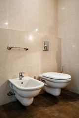Interior of five star hotel with large bathroom - suspended toilet, bidet in the corner