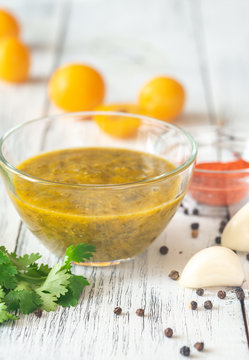 Bowl of tkemali with the ingredients