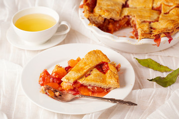 Freshly Baked Slice of Peach Pie with Tea