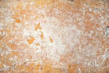 Texture of old wooden board. Dirty and scratched plywood. Table with white traces of flour and dough. The surface on which bread is made.