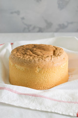 lush homemade sponge cake on a white towel