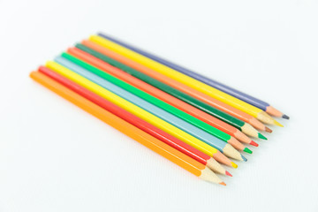 Fototapeta premium Color pencils on a white background isolated.
