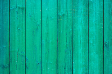 Fototapeta premium Green wooden background texture. Vertical planks, bars