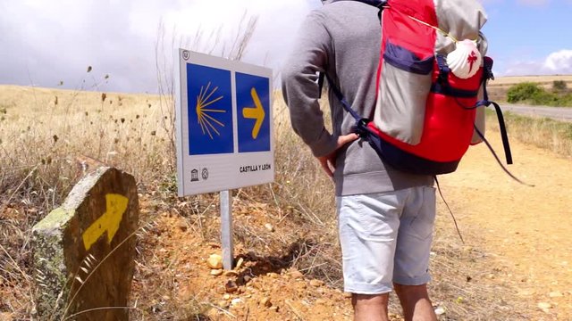 way of  st james to Compostela , pilgrim walking and looking  the signs  , video hd footage