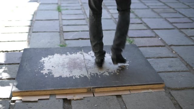 man dancing rhythmic dance on the street