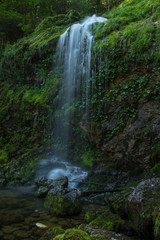 Fototapeta na wymiar Beautiful Small waterfall from side