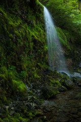 Fototapeta na wymiar Small waterfall from side 