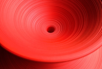 Bright red wrap plastic texture as background.