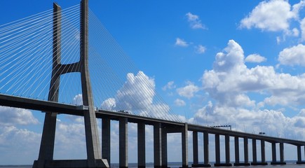 a lisbon bridge under the clouds