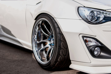 silvery alloy wheels. racing white car. drift, sports car. extreme sport
