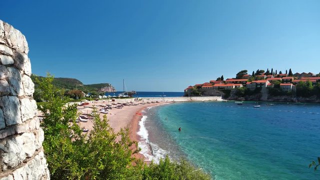 Adriatic Sea and Sveti or Saint Stefan in Montenegro. Sveti Stefan - resort and small islet in Montenegro, located on the Adriatic coast, on the Budva Riviera, 6 kilometers southeast of Budva
