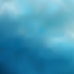 Blue blurred background combining from transitions of dark azure to gray-blue, cloudy sky after rain.