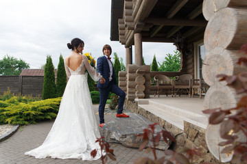 Newly married ready to enter in luxurious wooden mansion