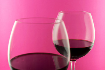 Glasses rose Wine against pink Background with copy space. Valentine's Day concept 