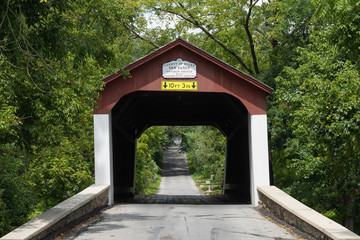 Historic Van Sandt covered bridge, also known as the Beaver Dam Bridge is a Town truss bridge, built with overlapping and connected triangles that distribute weight equally over the length.