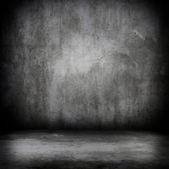 Grunge interior room with concrete wall and floor. Empty concrete space.