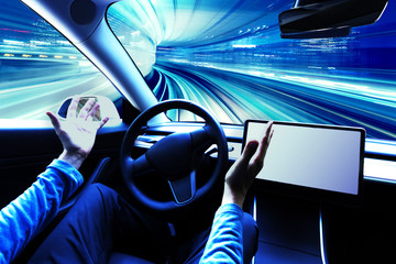 Person using a car in autopilot mode hands free
