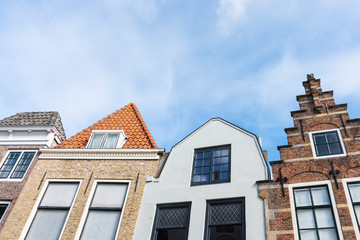 Fototapeta na wymiar historical gables of houses in street called Vlasmarkt. Middelburg, The Netherlands