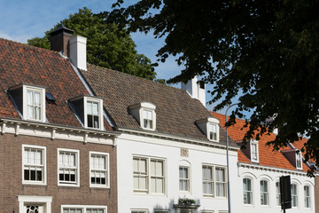 houses with roof tiles in street called Groenmarkt. Middelburg, The Netherlands