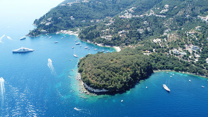 Obraz premium Aerial drone photo of iconic small port and fishing village of Kouloura with turquoise and emerald clear waters, Corfu island, Ionian, Greece