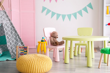 Stylish interior of modern playroom in kindergarten © Pixel-Shot