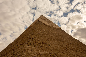 Fototapeta na wymiar Pyramide Top Stone Sky Clouds