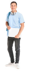 Portrait of young student with laptop on white background