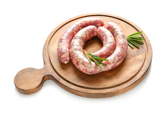Wooden board with fresh raw sausages on white background