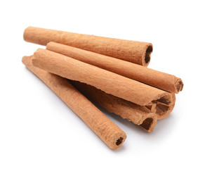 Aromatic cinnamon sticks on white background