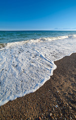 Waves on shore on sunny day in Antalya Turkey