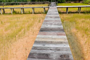 Wooden bridge walkway along concept for go to target