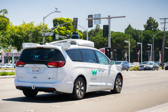 August 6, 2017 Mountain View/Ca/USA - Waymo self driving car cruising on a street, Silicon Valley