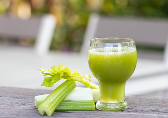 Celery fresh and Celery juice detox healthy diet on wooden table