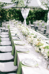 wedding reception table setting, outdoor summer wedding, white and green flowers